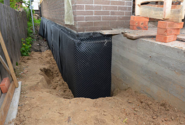 SJ Waterproofing Pros technician performing targeted Sump Pump Installation assessment in Kirklin, IN